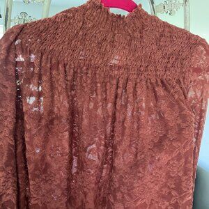 Rust-colored Lace swing top by Anthropologie